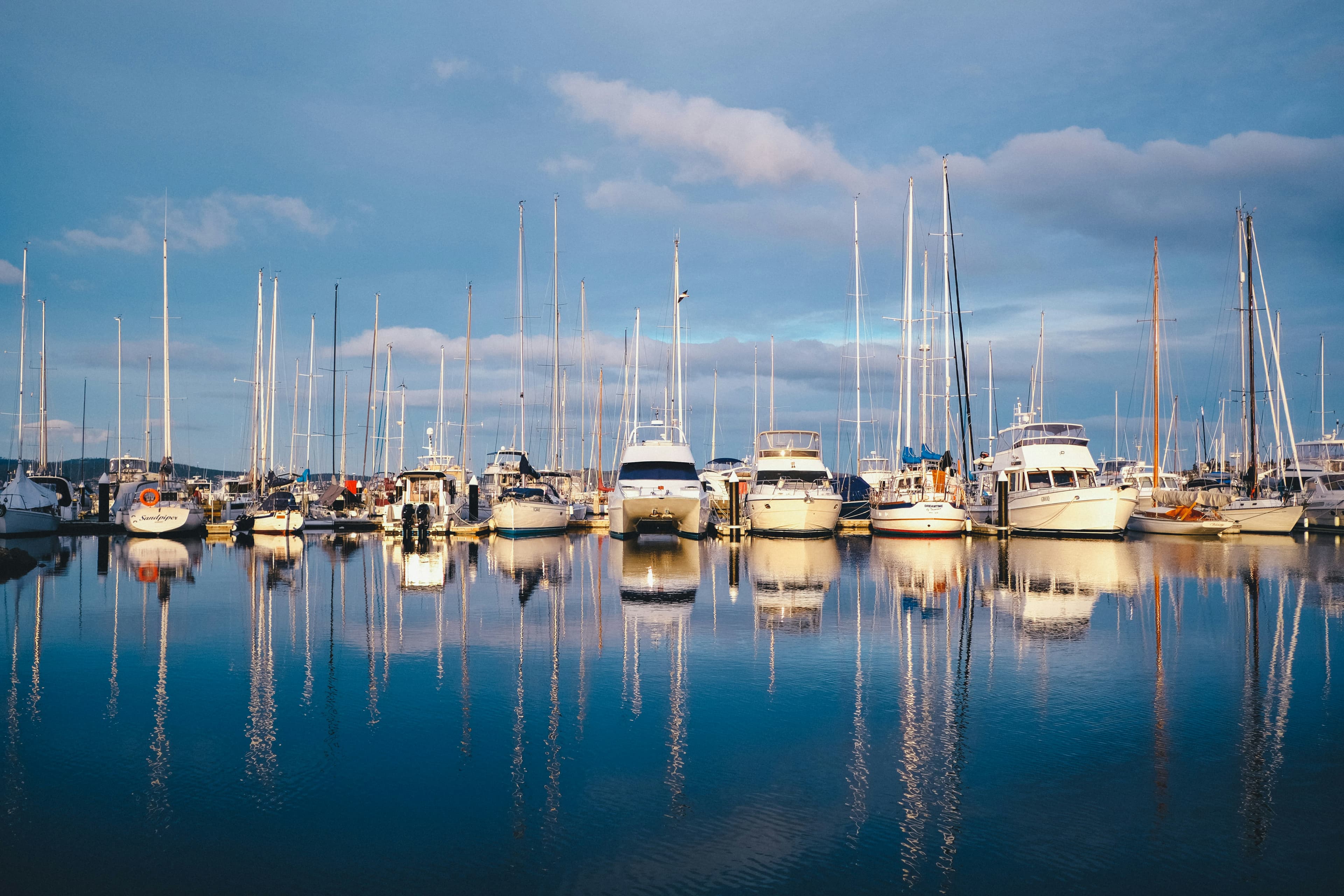 Marina at sunrise with charter boats docked